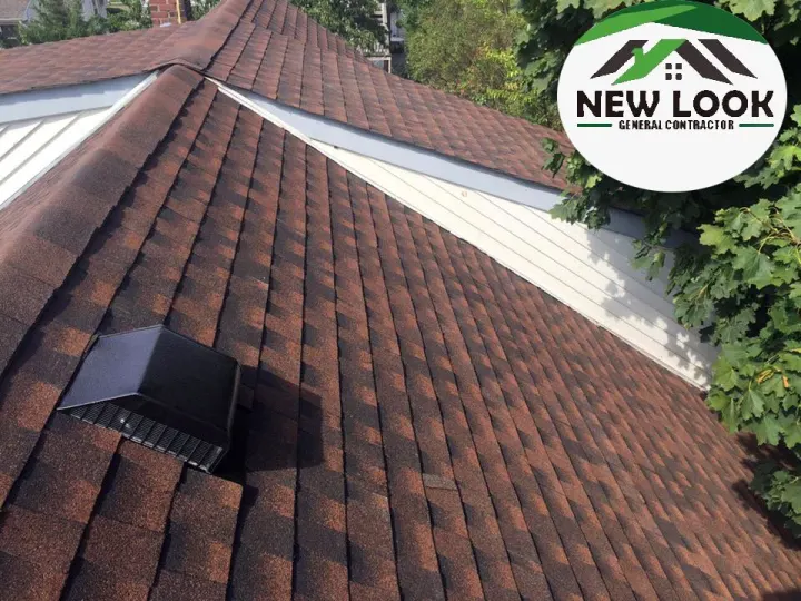 Finished brown shingle roof with a vent