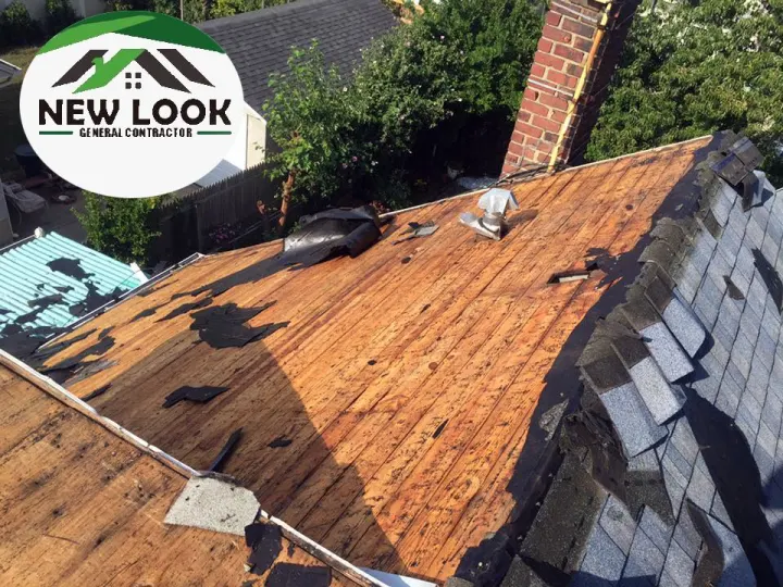 Roof deck ready for new roofing next to a brick chimney