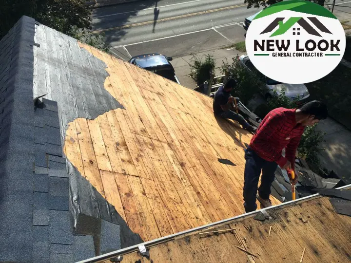 Roofer removing old shingles down to the decking
